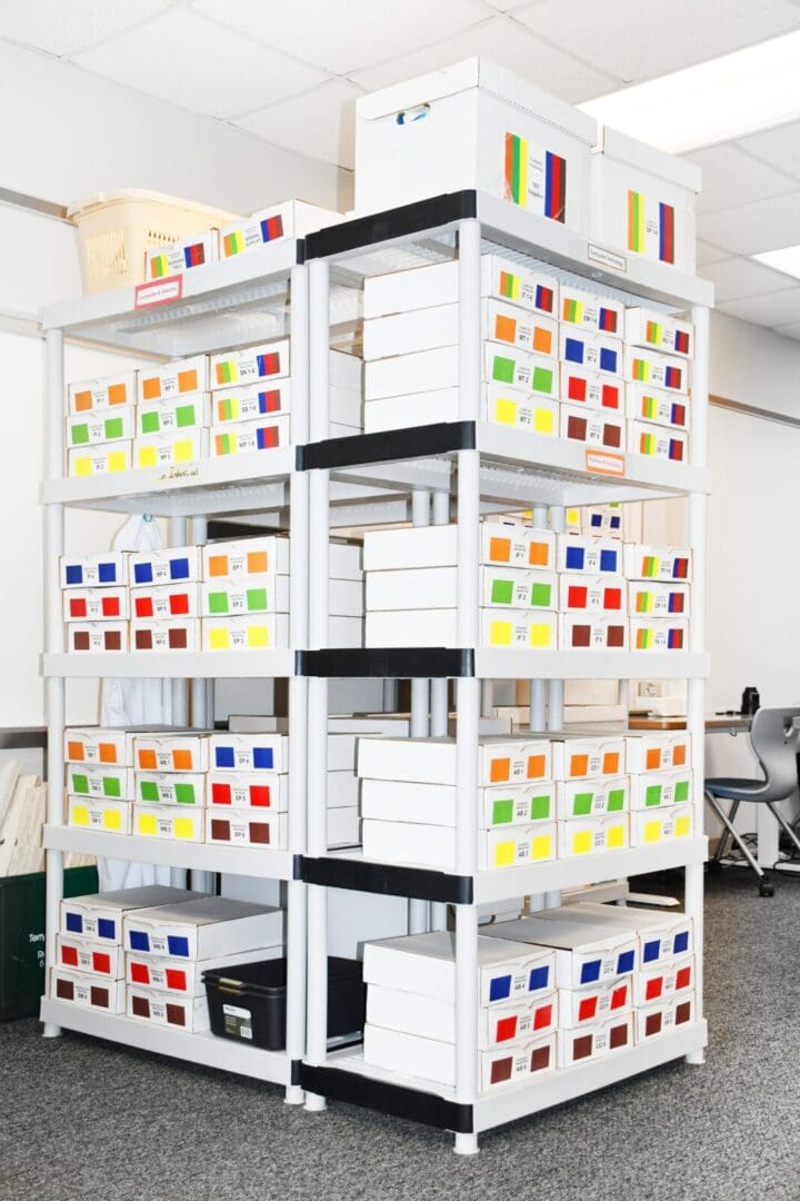 A tall rack with many boxes on top of it.