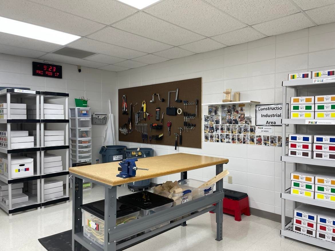 A room with many shelves and a table