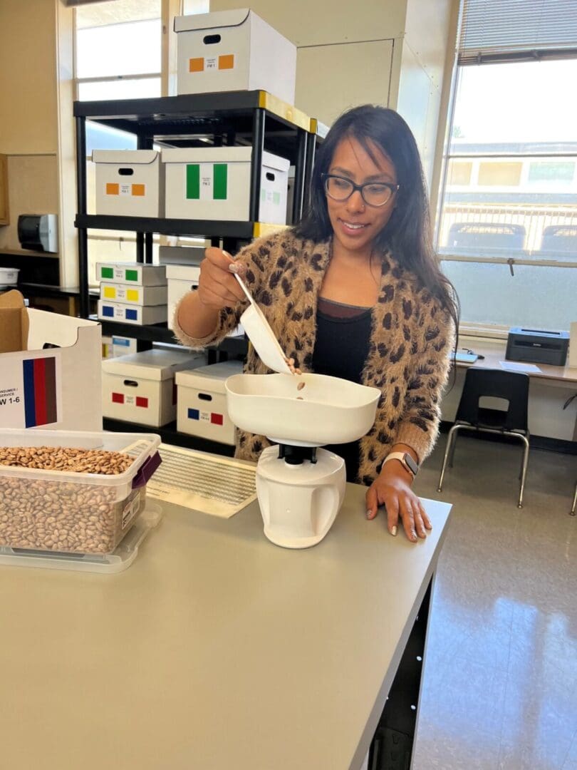 Woman weighing beans with white scale