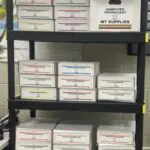 A shelf with many boxes of mail