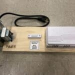 A wooden board with some wires and a card reader