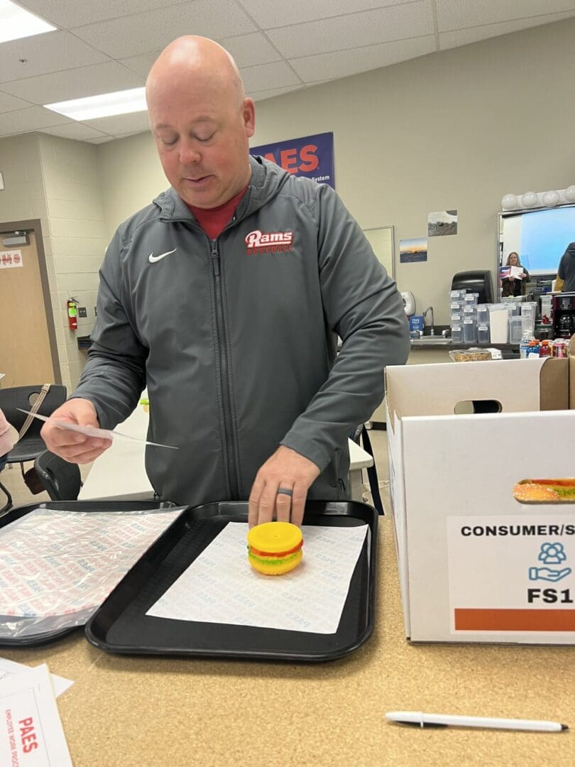 A man is preparing food on the counter.