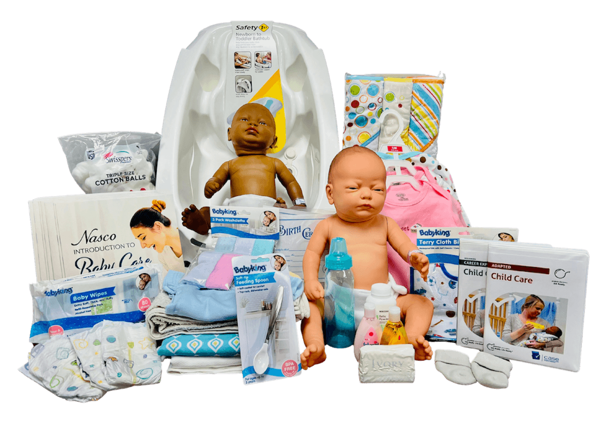 Baby care kit with dolls and supplies.