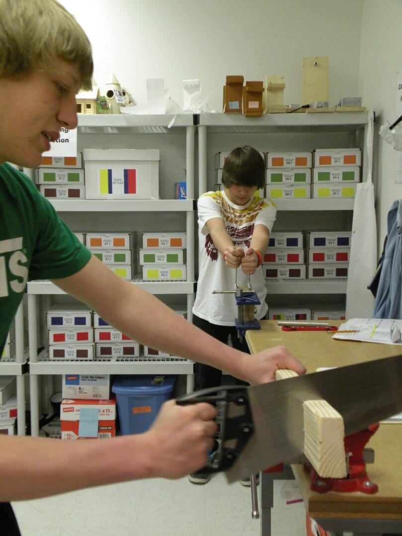Students working on construction jobs in work lab setting