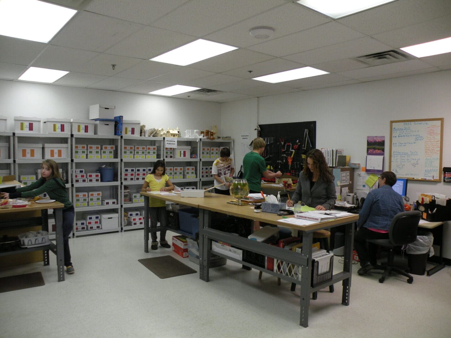 People working in an organized office space.
